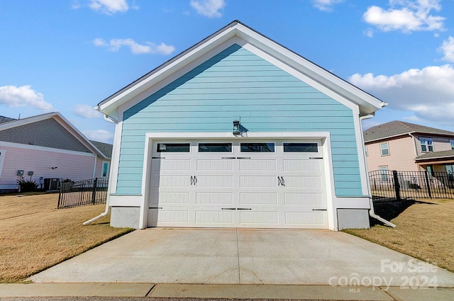 garage featuring a lawn