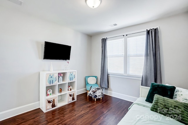 bedroom featuring dark hardwood / wood-style flooring