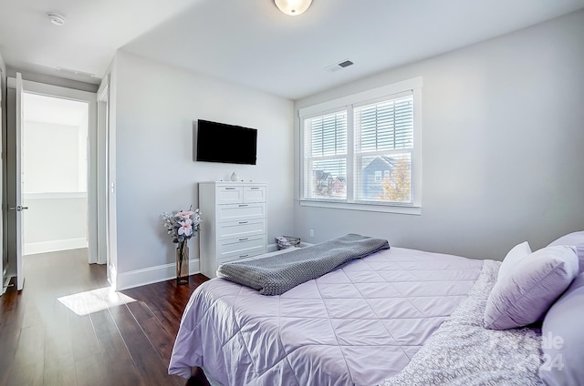 bedroom with hardwood / wood-style flooring