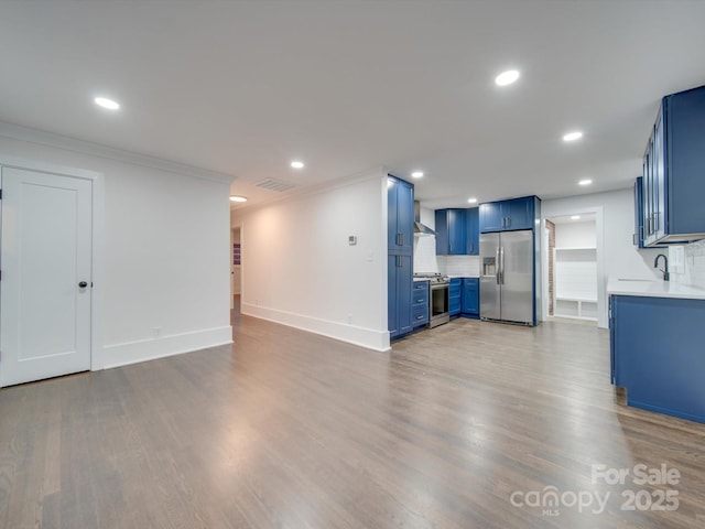 unfurnished living room featuring crown molding and light hardwood / wood-style flooring