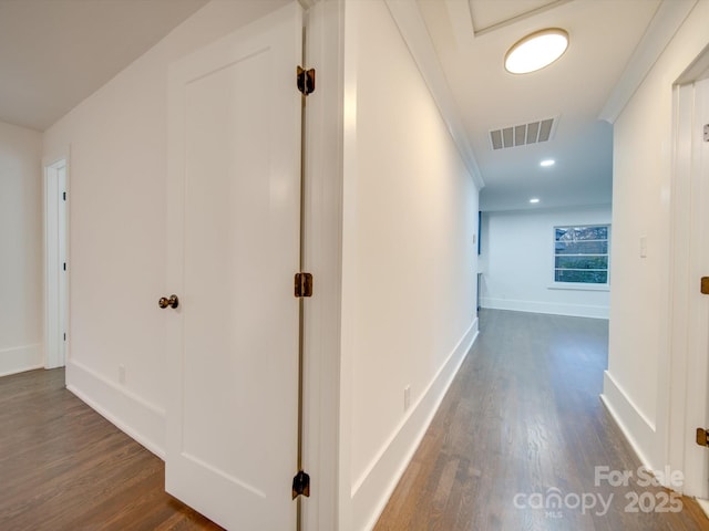 corridor with crown molding and dark hardwood / wood-style floors