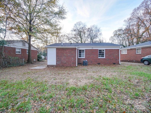 rear view of house with central AC