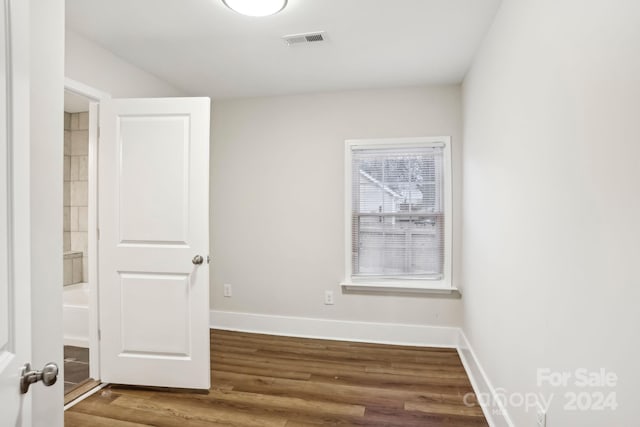 unfurnished room featuring wood-type flooring