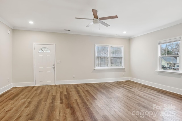 entrance foyer featuring recessed lighting, light wood-style flooring, and baseboards