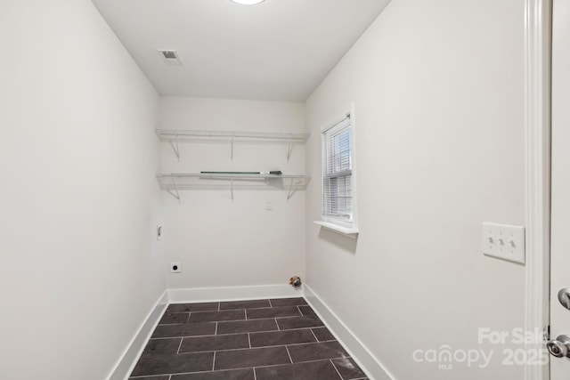 clothes washing area featuring laundry area, baseboards, visible vents, and electric dryer hookup