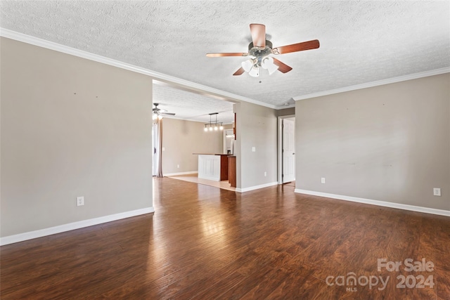 unfurnished room with dark hardwood / wood-style flooring, a textured ceiling, ceiling fan, and crown molding