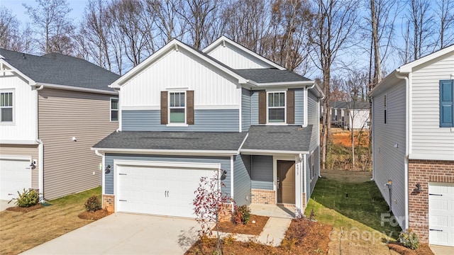 view of front of home featuring a garage and a front yard