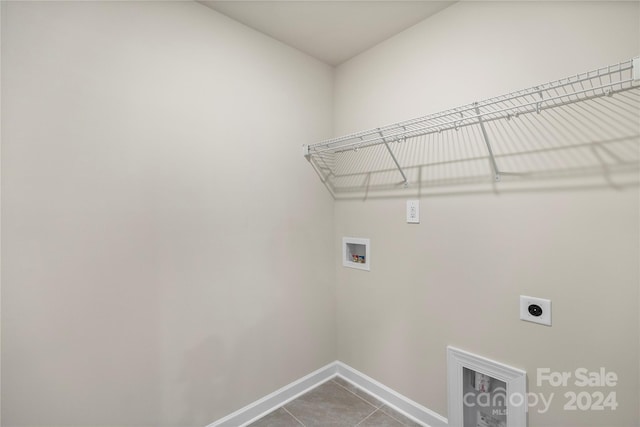 clothes washing area featuring washer hookup, hookup for an electric dryer, and tile patterned floors