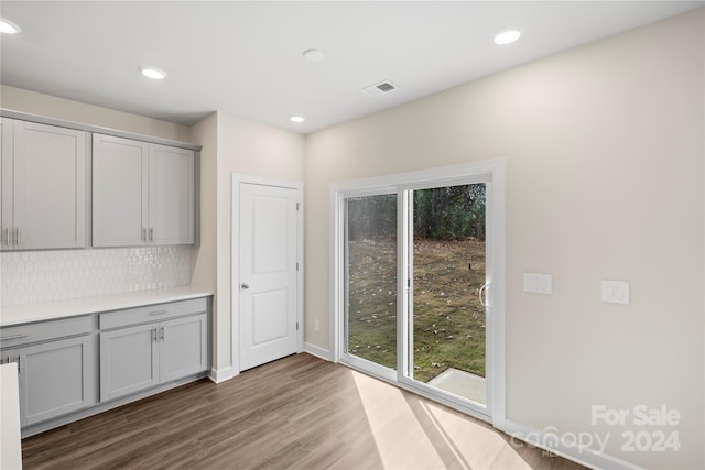 unfurnished dining area with hardwood / wood-style floors and a wealth of natural light