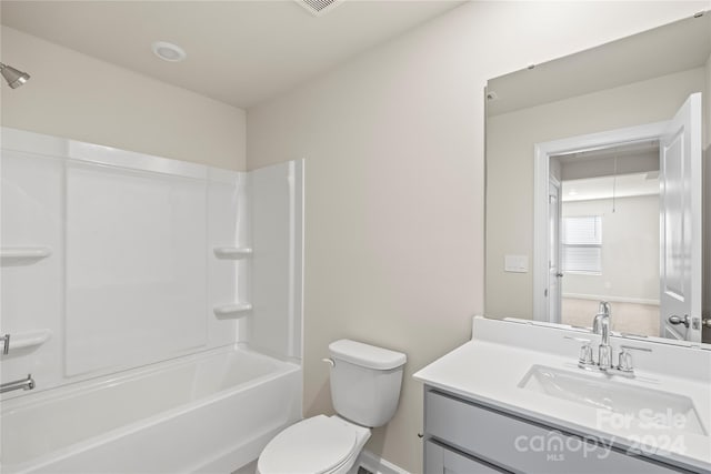 full bathroom with vanity, toilet, and shower / washtub combination