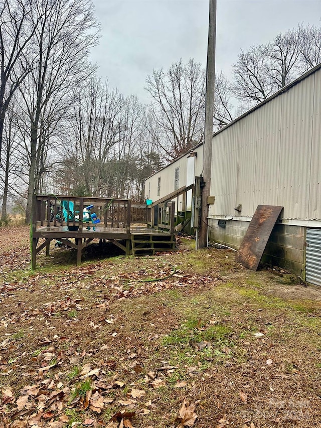 view of yard featuring a wooden deck