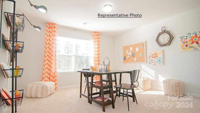 dining space with light colored carpet