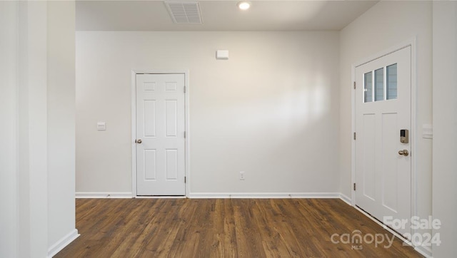 foyer entrance featuring dark hardwood / wood-style flooring