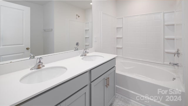 bathroom with tile patterned flooring, vanity, and bathing tub / shower combination