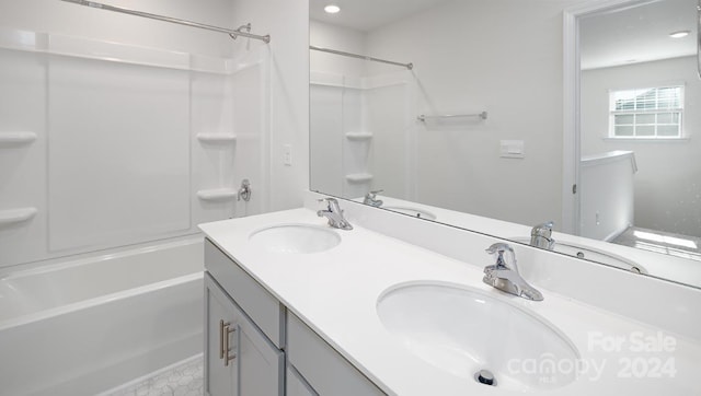 bathroom with vanity and bathing tub / shower combination