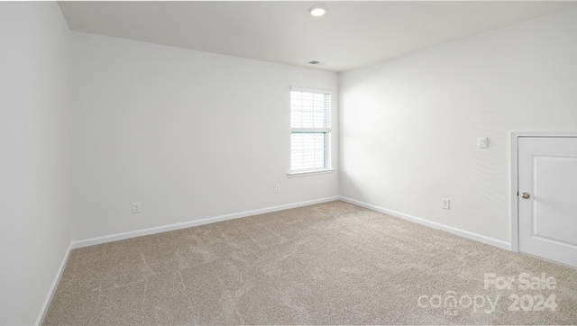 spare room featuring carpet flooring