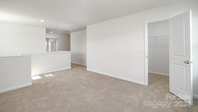 unfurnished room with light colored carpet