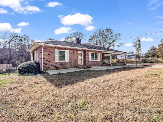 ranch-style home featuring a patio area and a front lawn