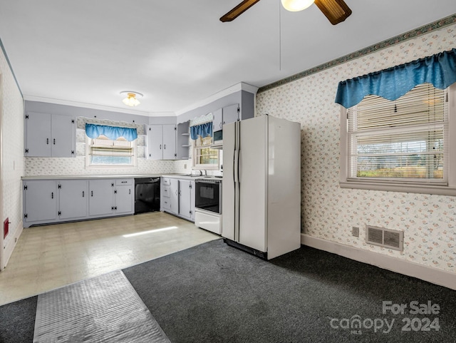 kitchen with dishwasher, white fridge, range, and crown molding