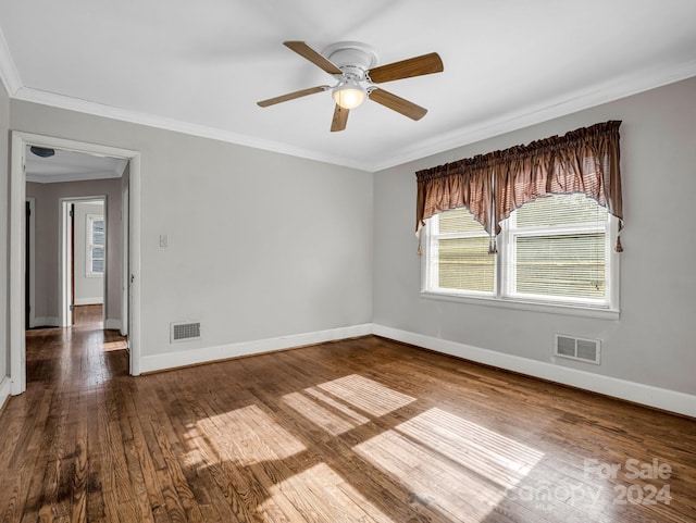 empty room with hardwood / wood-style floors, ceiling fan, and crown molding