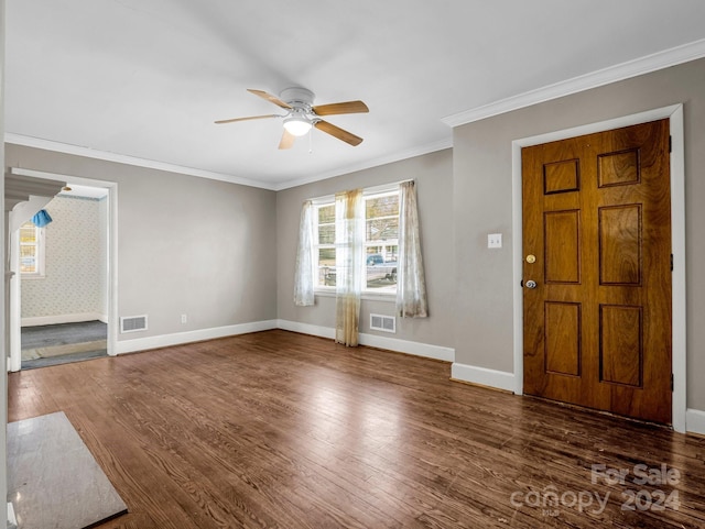 foyer with ceiling fan, dark hardwood / wood-style flooring, and ornamental molding