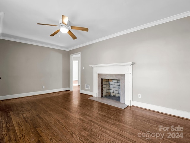 unfurnished living room with ceiling fan, ornamental molding, and dark wood-type flooring