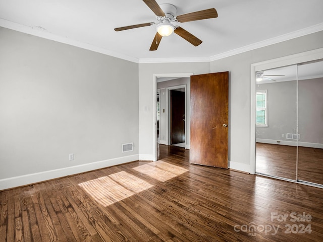 unfurnished bedroom featuring a closet, hardwood / wood-style floors, ceiling fan, and ornamental molding