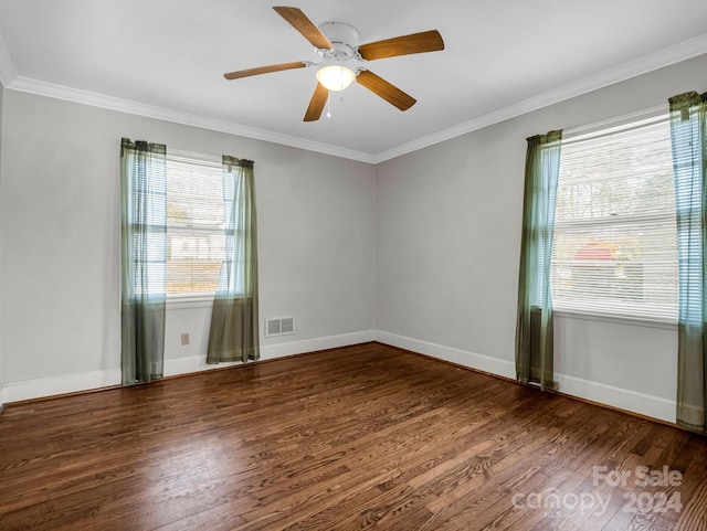 unfurnished room featuring crown molding, dark hardwood / wood-style flooring, and ceiling fan