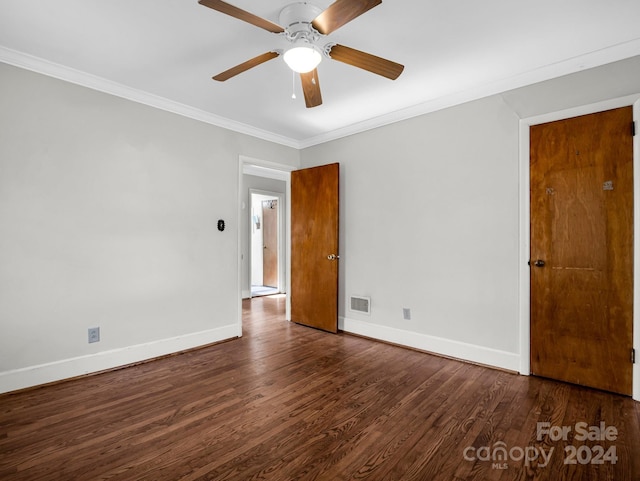 spare room with crown molding, ceiling fan, and dark hardwood / wood-style floors