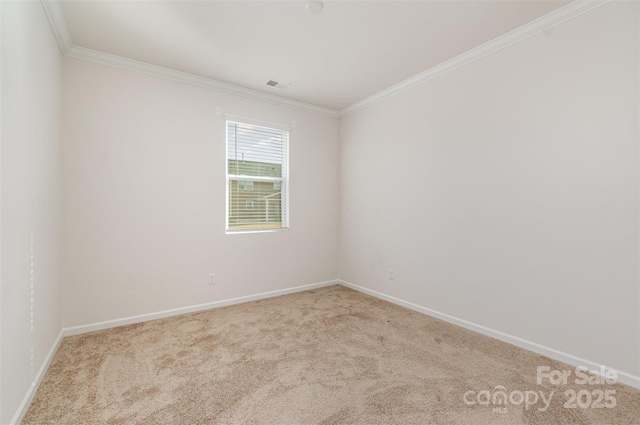 carpeted spare room with crown molding