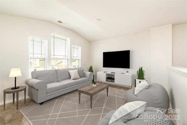 living room featuring lofted ceiling and light carpet