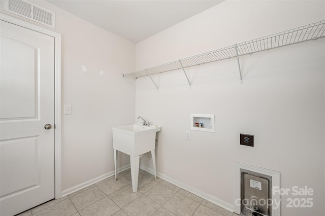 laundry room with electric dryer hookup and washer hookup