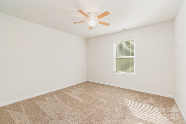 carpeted empty room with ceiling fan