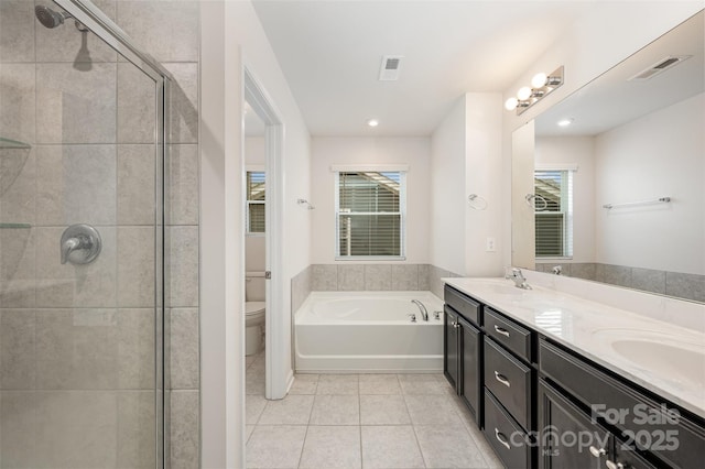 full bathroom with shower with separate bathtub, tile patterned flooring, vanity, and toilet