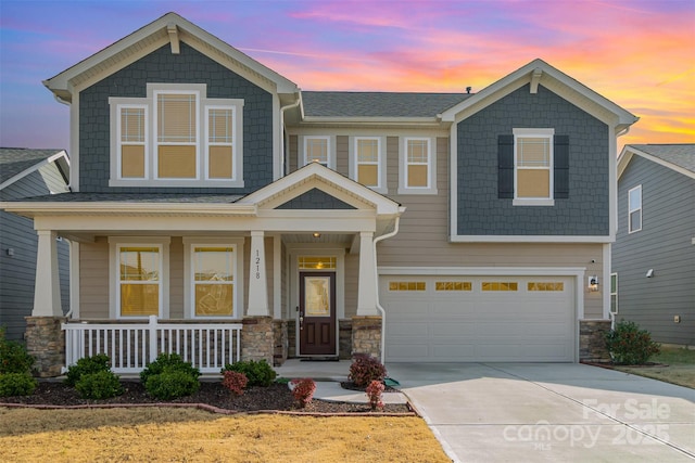 craftsman house with a garage and a porch