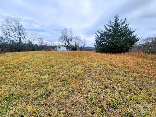 view of yard with a rural view