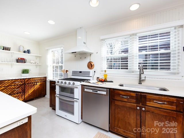 kitchen with dishwasher, sink, premium range hood, double oven range, and ornamental molding