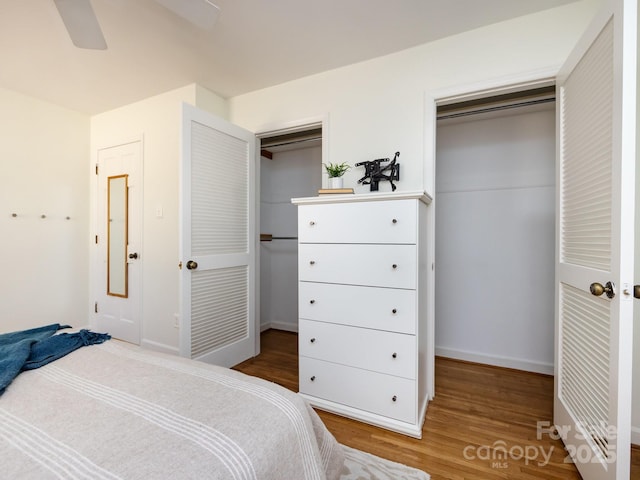 bedroom with ceiling fan and hardwood / wood-style floors