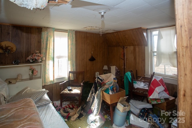 misc room featuring wood walls