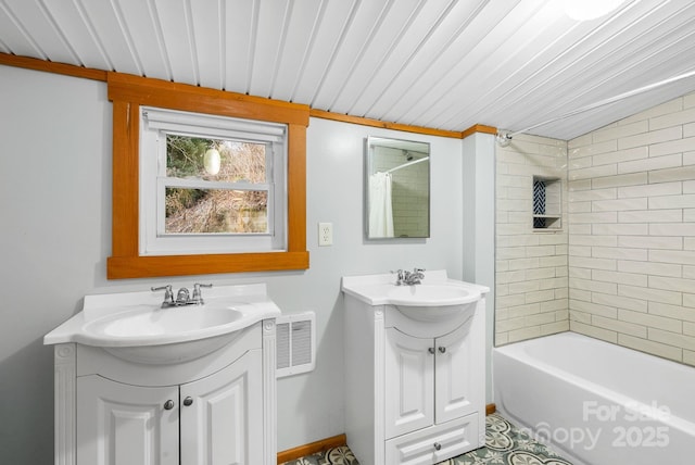 bathroom featuring vanity and shower / bath combo