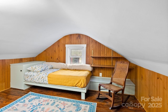 bedroom with dark hardwood / wood-style floors and lofted ceiling