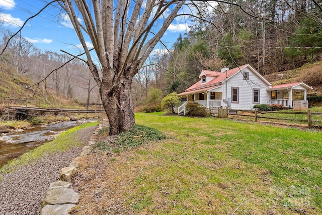 view of yard featuring covered porch