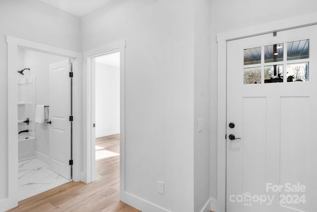 foyer with light wood-type flooring