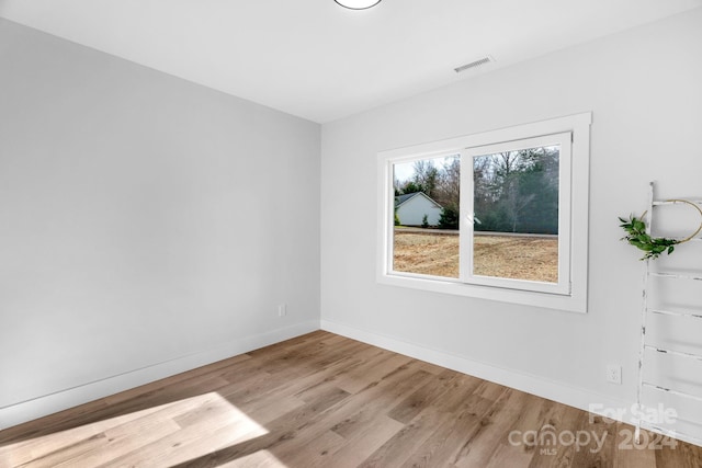 spare room featuring light hardwood / wood-style floors