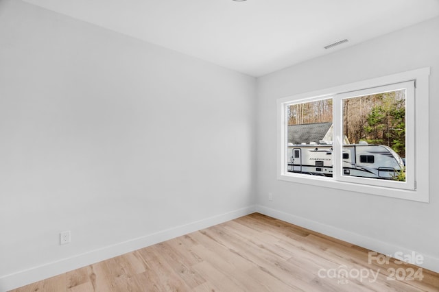 unfurnished room featuring light wood-type flooring