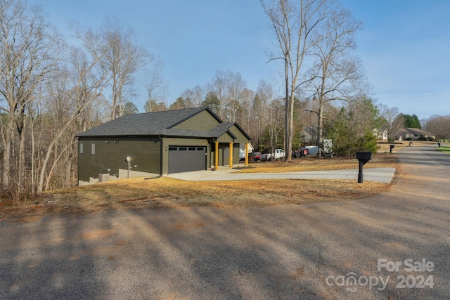 view of property exterior with a garage