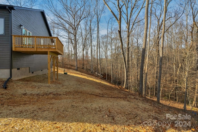 view of yard with a wooden deck