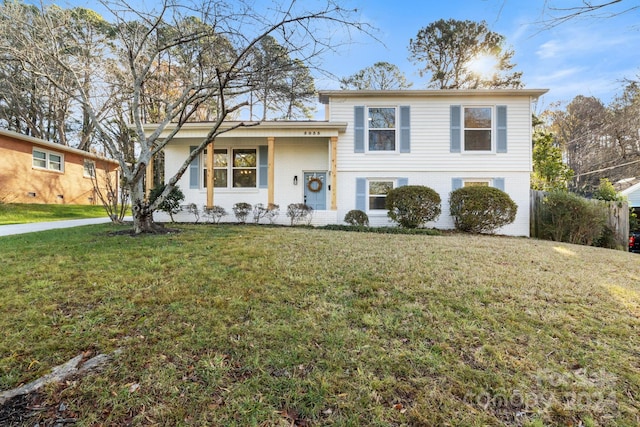 tri-level home featuring a front lawn