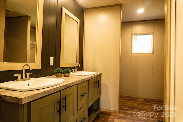 bathroom featuring vanity and hardwood / wood-style flooring