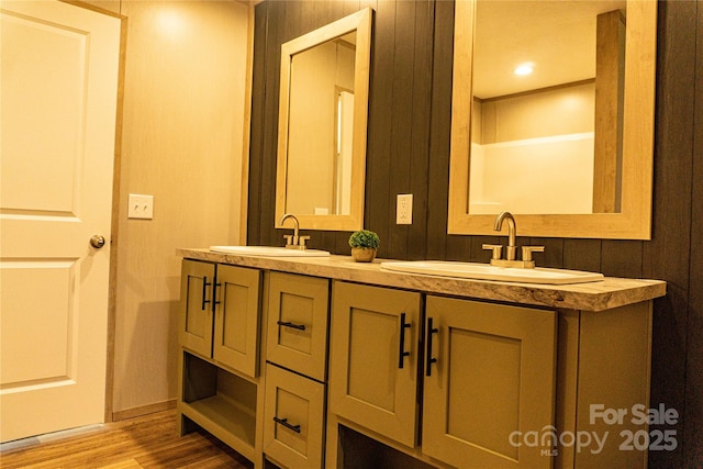 bathroom featuring vanity and hardwood / wood-style flooring